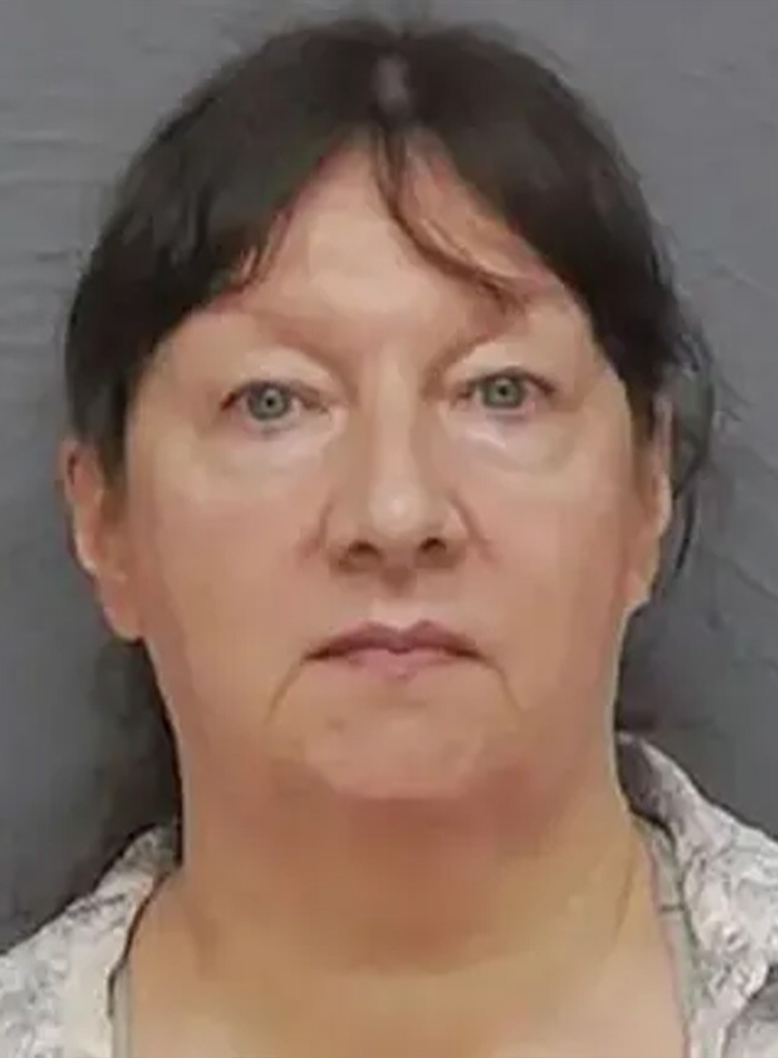 Mugshot of a grandma, arrested for homicide, after her granddaughter's ancestry DNA test.