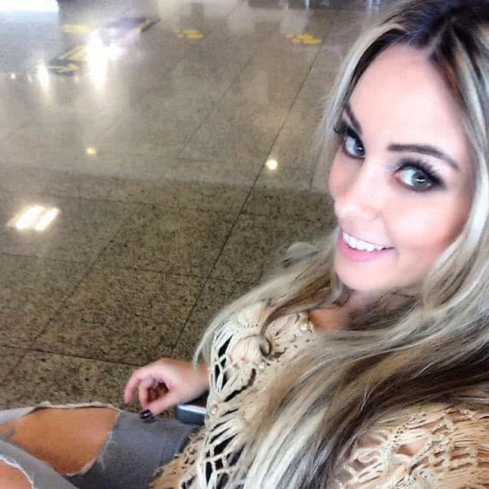 Woman smiling for a selfie, a reminder of the personal journey behind cosmetic procedures and life-changing choices. Woman smiling for a selfie, a reminder of the personal journey behind cosmetic procedures and life-changing choices.
