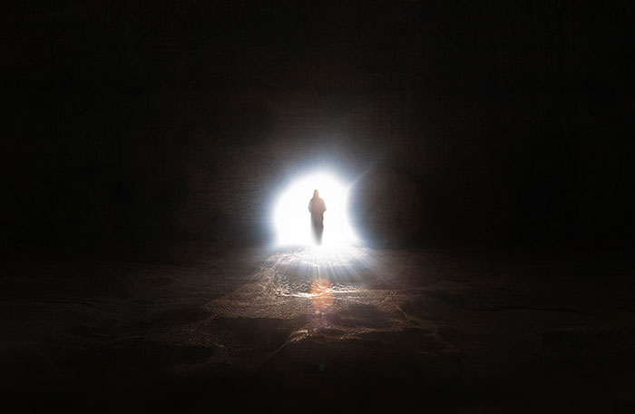 A silhouette of a person walking towards a bright light at the end of a dark tunnel, symbolizing an atheist's near-d***h experience. A silhouette of a person walking towards a bright light at the end of a dark tunnel, symbolizing an atheist's near-d***h experience.