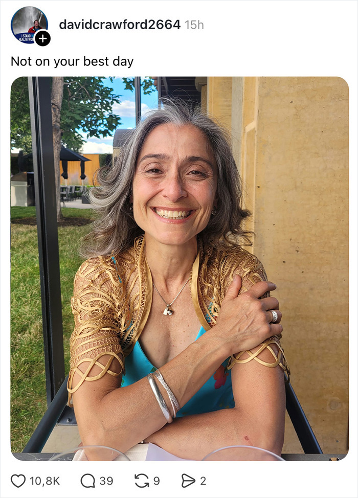 A smiling woman with gray hair, looking at the camera, part of a wife appreciation thread.