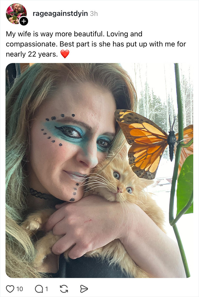 A woman with face paint holding a kitten and a butterfly, part of a wife appreciation thread.