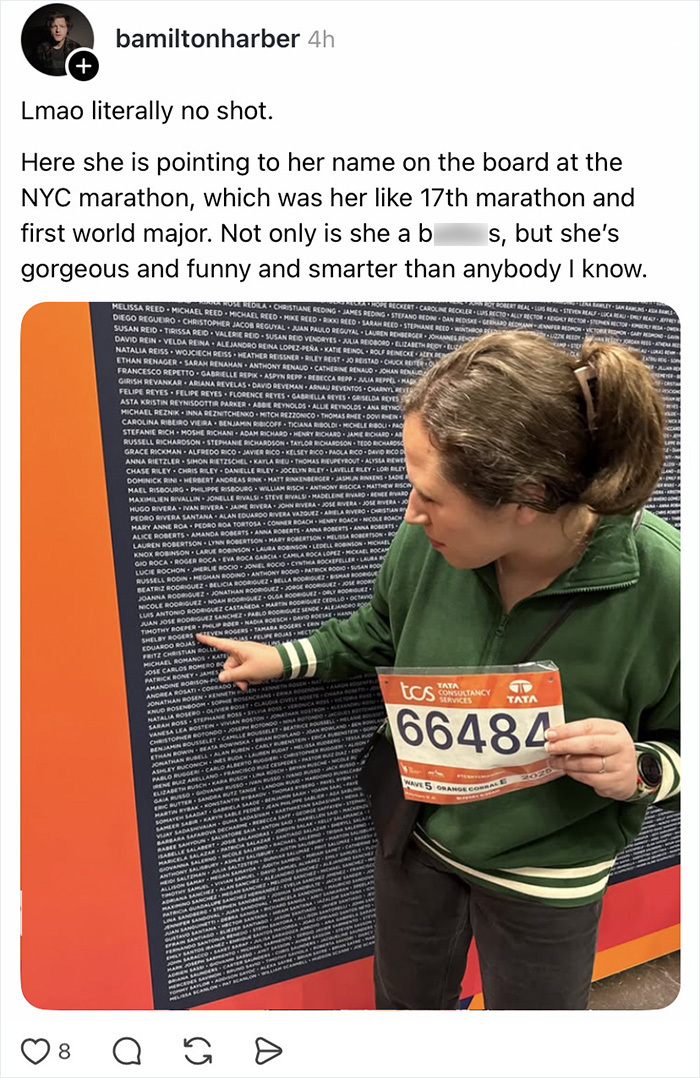 A woman pointing at her name on a marathon board, contributing to a wife appreciation thread.