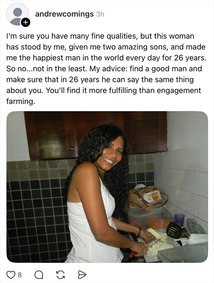 A woman smiling while chopping vegetables in a kitchen, featured in a wife appreciation thread.