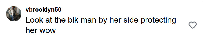 A user comment pointing out a man protecting a woman who hurls the N-word on the street. A user comment pointing out a man protecting a woman who hurls the N-word on the street.