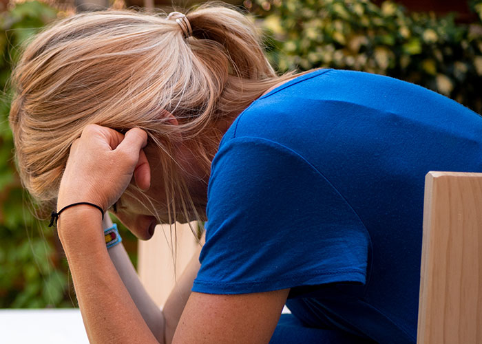 A woman considering whether to accept marriage proposals, highlighting the choice women make.