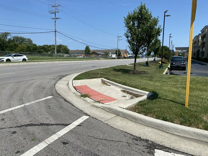 Curb construction fail missing sidewalk access at road corner