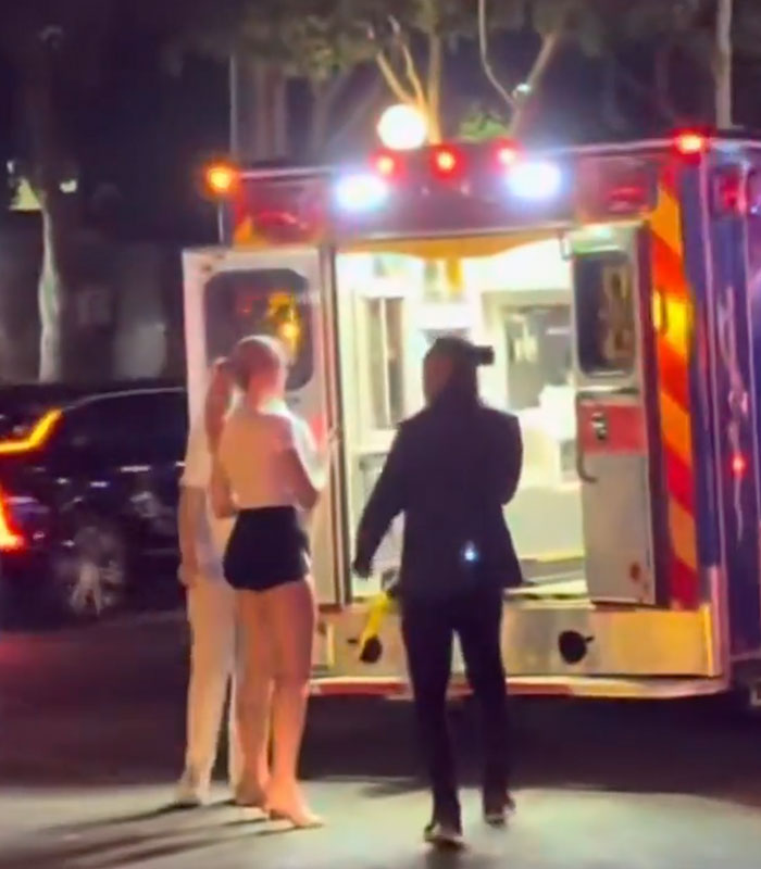Influencer couple block an ambulance while posing for a photo Influencer couple block an ambulance while posing for a photo