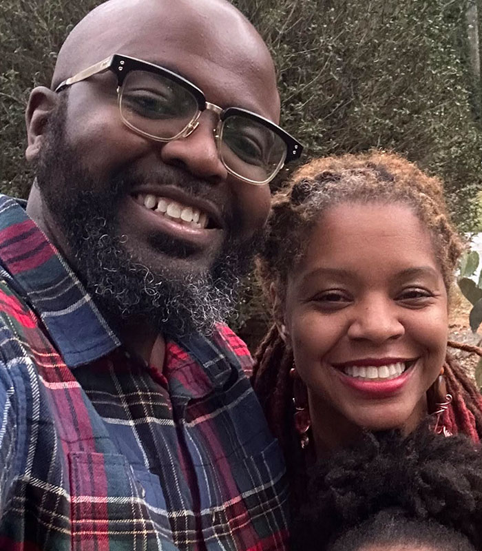 Father identified after viral Six Flags accident posing closely for a photo with a woman.