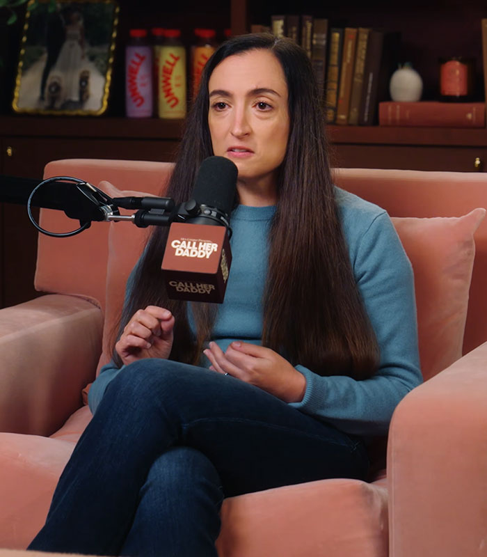 Close-up of a woman gesturing while speaking on a podcast regarding the Cornell 7 scandal.