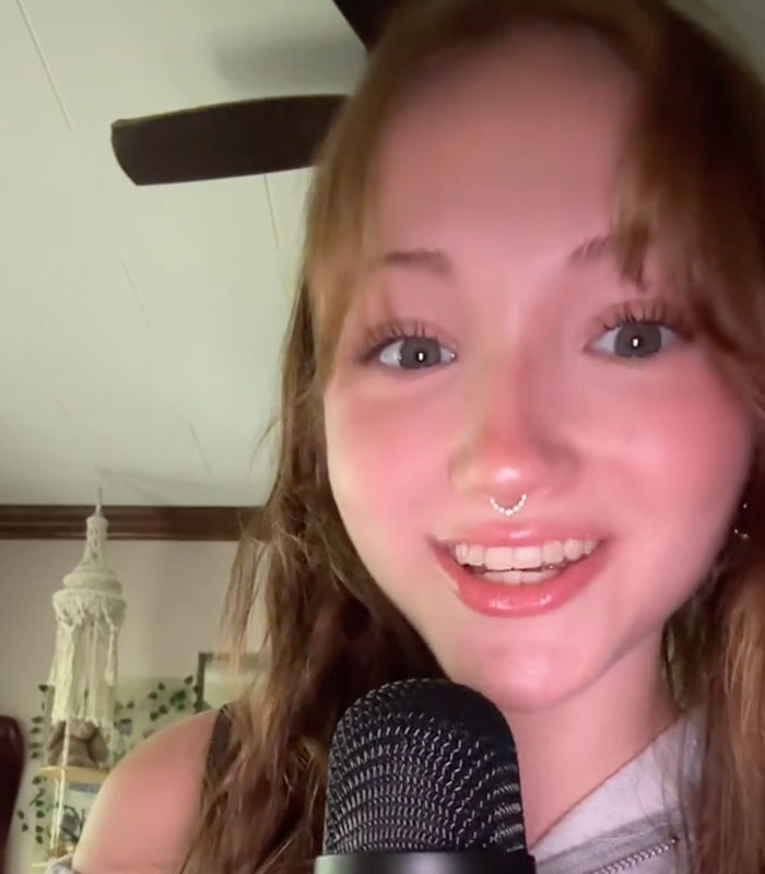 A server close up with a microphone telling stories about unhinged things customers have said. A server close up with a microphone telling stories about unhinged things customers have said.