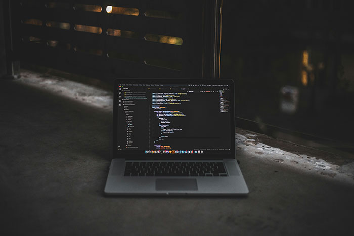 Open laptop displaying lines of programming code representing cybersecurity and AI agent swarms. Open laptop displaying lines of programming code representing cybersecurity and AI agent swarms.