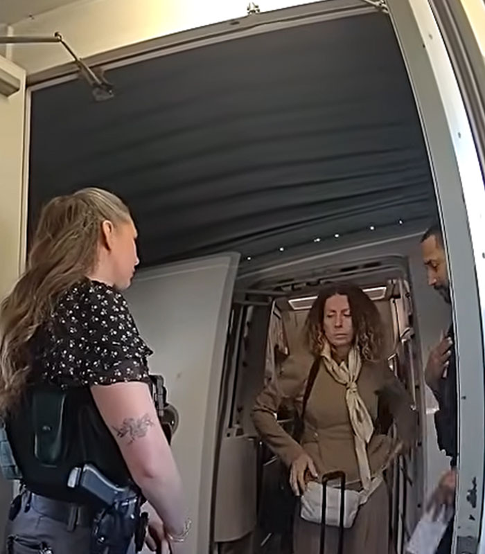 Police officer standing on an airplane near a mom arrested after leaving kids home alone for a trip Police officer standing on an airplane near a mom arrested after leaving kids home alone for a trip