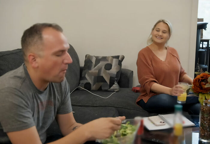 G***y Rose Blanchard smiling while sitting next to her fiancé, Ken Urker, as he eats on a sofa. G***y Rose Blanchard smiling while sitting next to her fiancé, Ken Urker, as he eats on a sofa.