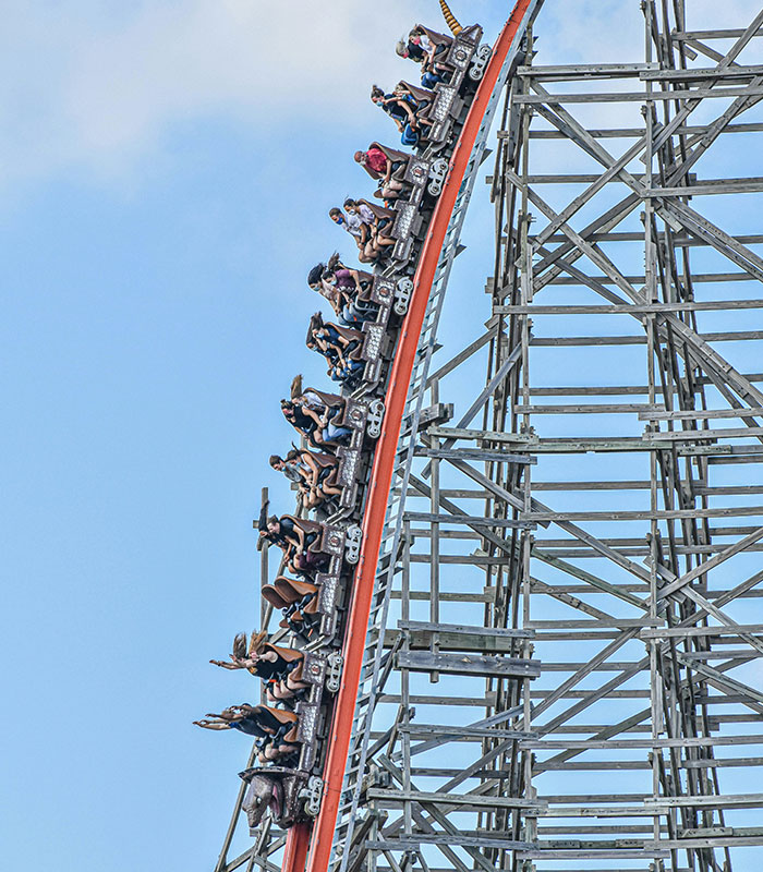 A steep wooden roller coaster ride descending during a viral Six Flags accident.