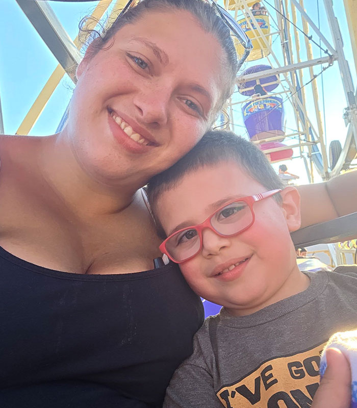 Smiling mom and child with glasses at a popular family resort