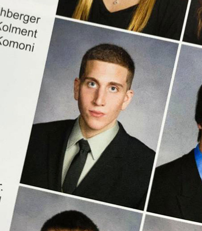 Yearbook portrait photo of a young Bryan Kohberger in a suit and tie