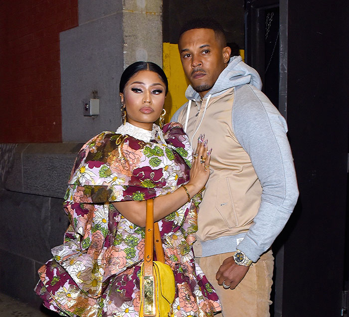 Nicki Minaj posing outdoors with her husband Kenneth Petty
