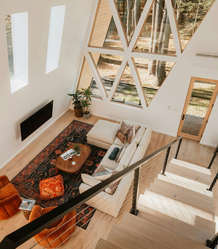 High angle view of a modern living room inside a cozy cabin Airbnb host rental property