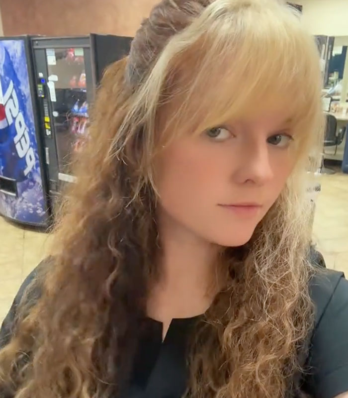A young woman with blonde bangs and long curly hair representing the woman dated a man for four years A young woman with blonde bangs and long curly hair representing the woman dated a man for four years