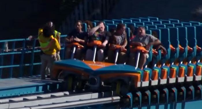 Passengers seated in a roller coaster car before a viral Six Flags accident.