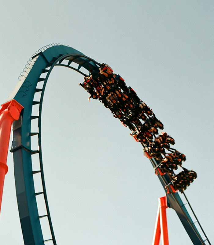 A high-speed roller coaster train on an inverted track during a Six Flags accident incident.