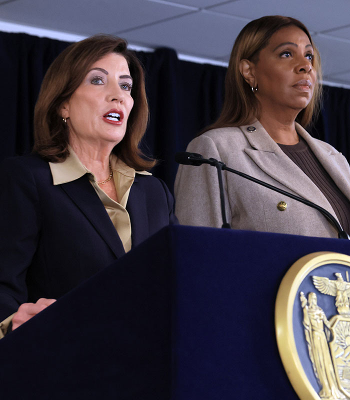 Two women at a press conference addressing the Cornell 7 scandal.
