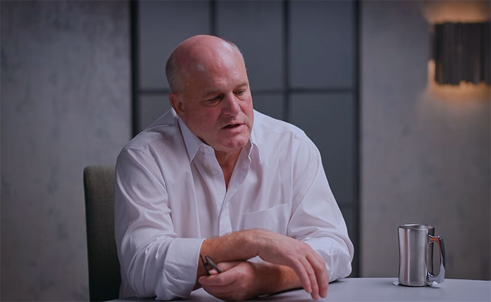Doctor sitting at a table having end-of-life conversations about patients dreams. Doctor sitting at a table having end-of-life conversations about patients dreams.
