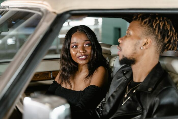 Couple having conversation inside a car admitting seriously disturbing things