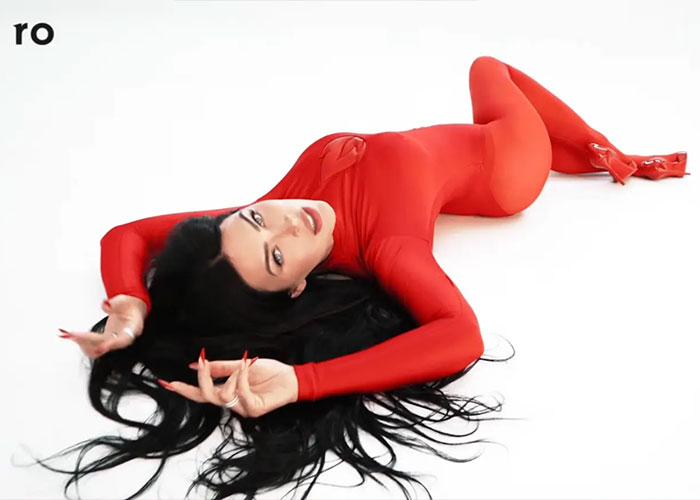 Megan Fox lying down in a red bodysuit from her campaign for male performance issues. Megan Fox lying down in a red bodysuit from her campaign for male performance issues.