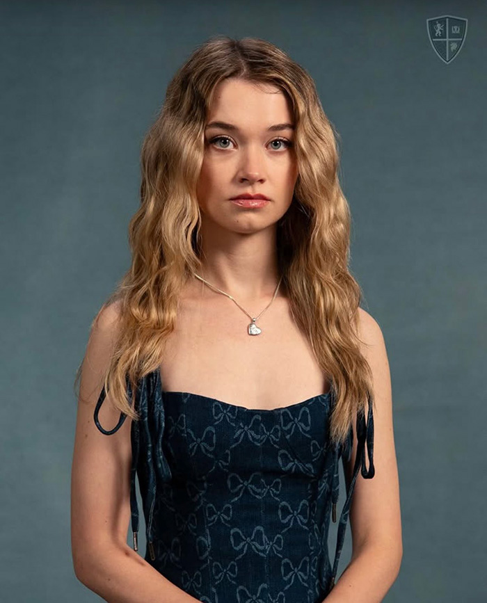 Hollywood Rising Star Alison Thornton posing in a dark blue patterned dress
