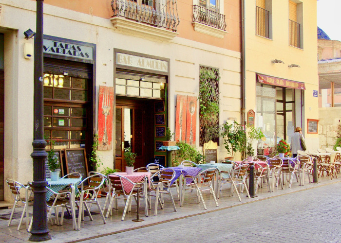 Charming European outdoor restaurant setup highlighting local customer service and dining out culture Charming European outdoor restaurant setup highlighting local customer service and dining out culture