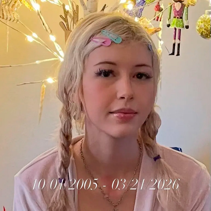 Portrait of FIT student with braided hair and birth-d***h dates shown