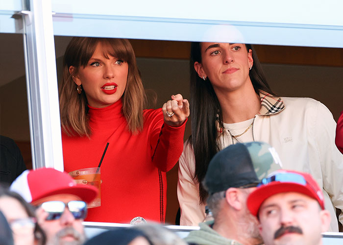 Taylor Swift pointing while watching from a suite at the Chiefs game Taylor Swift pointing while watching from a suite at the Chiefs game
