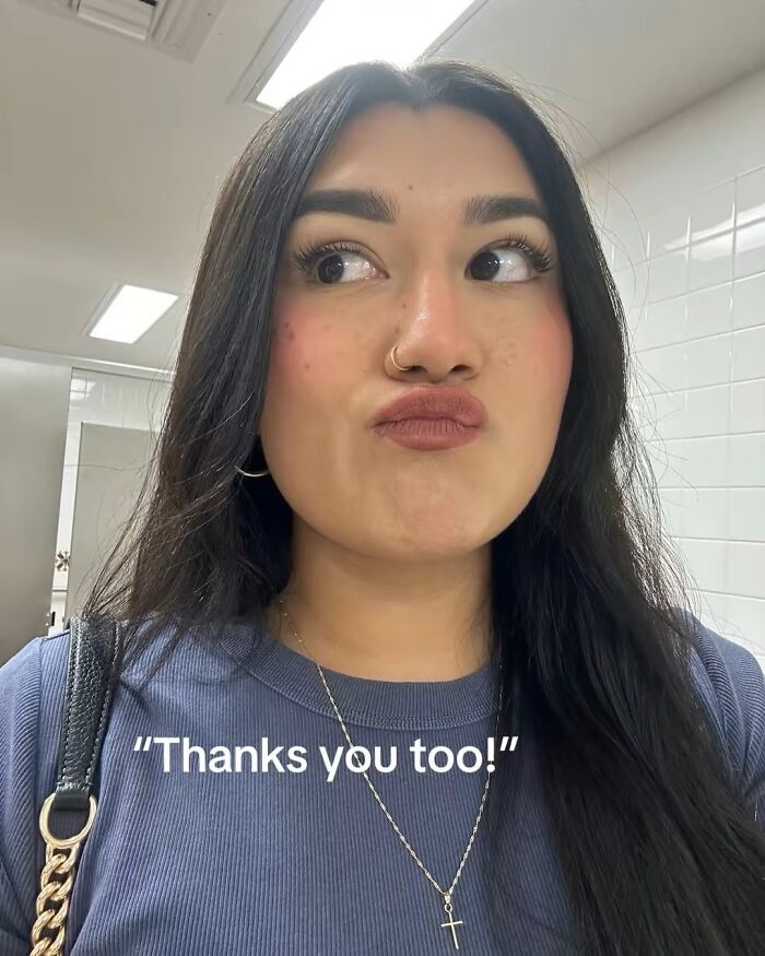 Woman making a funny face while thinking about adopting a rescue dog.