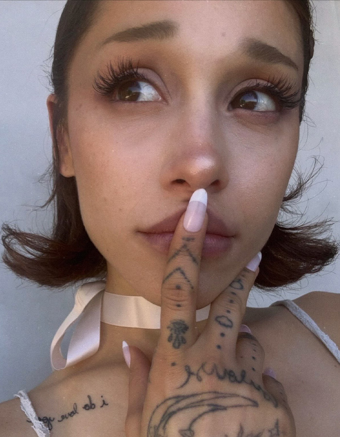 Ariana Grande shows off her hair transformation with short hair after ditching her ponytail.