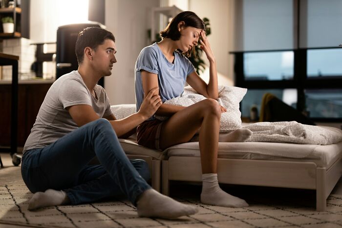 A man attempting to comfort a distressed woman, capturing unexpected moments in relationships.