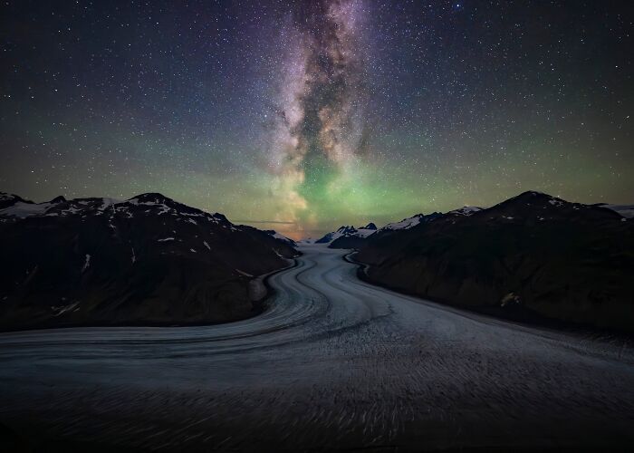 Natural landscape photography awards shot of Milky Way and aurora over a glacier valley