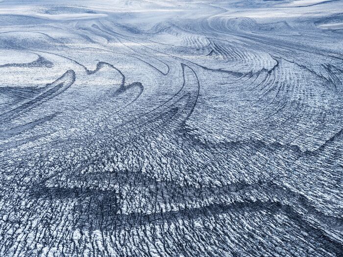 Natural landscape photography awards winning view of textured ice and glacier patterns
