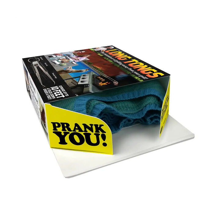An open fake product prank gift box revealing a real sweater hidden inside An open fake product prank gift box revealing a real sweater hidden inside