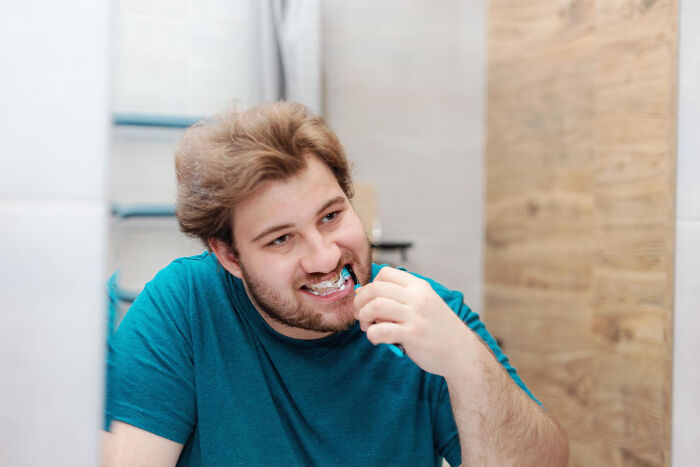 A smiling man brushing his teeth, contrasted with people share breaking point moments.
