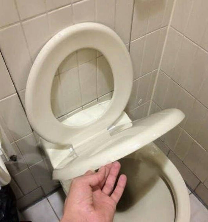 A poorly installed toilet seat that is a complete home renovation fiasco.