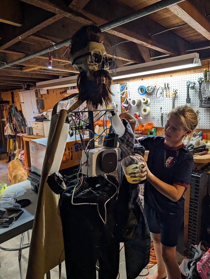 A young girl assembling Uncle Murray, a talking skeleton with a beard. A young girl assembling Uncle Murray, a talking skeleton with a beard.
