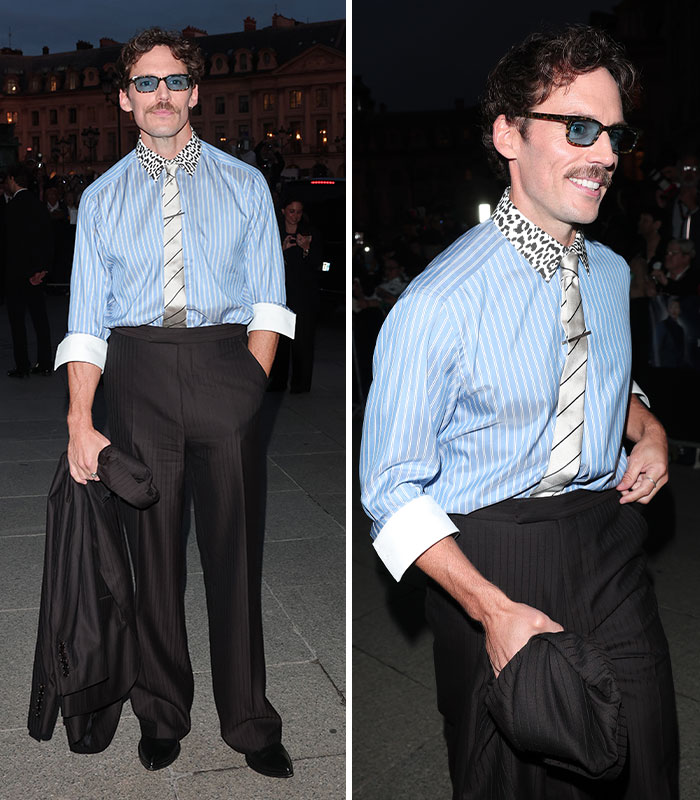 Sam Claflin in a blue striped shirt with a leopard collar at the Paris Fashion Week.