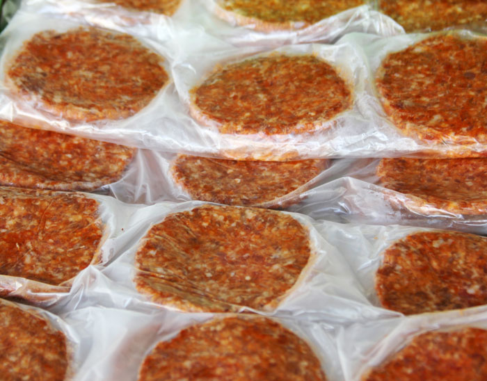 Packages of frozen meat patties representing property split in divorce stories