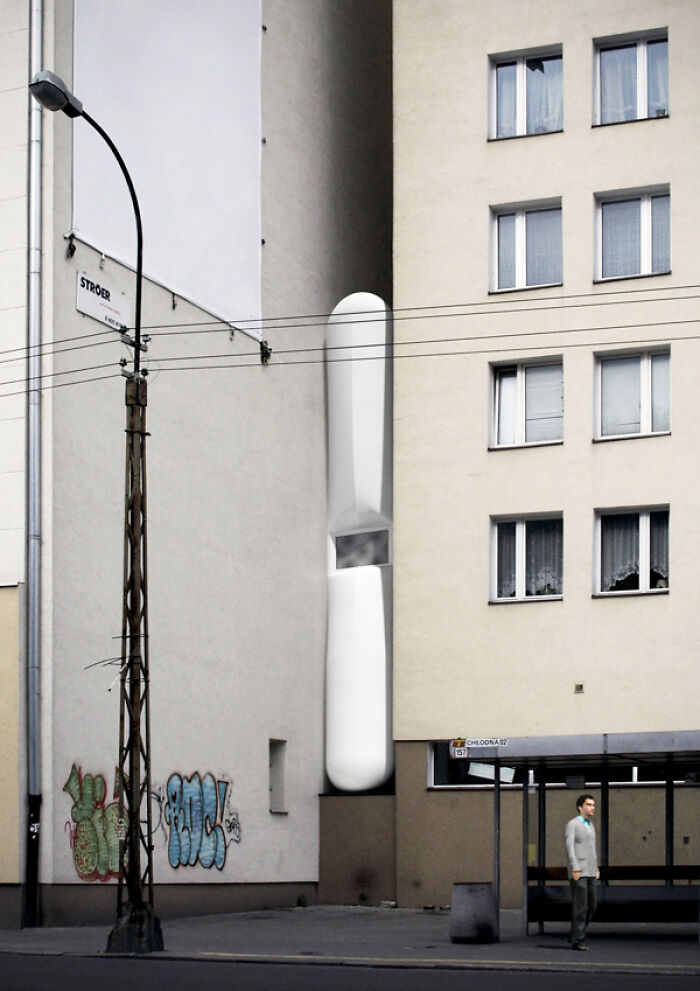 Narrow strange building squeezed between apartment blocks showing unusual architecture