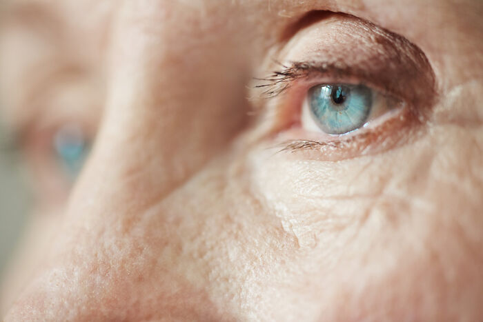 Extreme close-up of a blue eye, representing awareness and emergency tips for vision and head injuries.