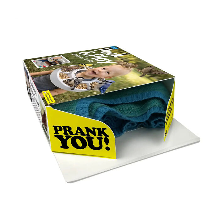 An opened hilarious gift box for fake products revealing a real blue sweater inside. An opened hilarious gift box for fake products revealing a real blue sweater inside.