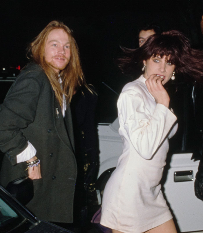 Axl Rose and Erin Everly seen out together during their brief relationship, an example of short celebrity marriages.