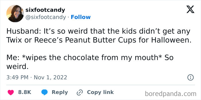 A humorous Halloween tweet about a parent eating their kids trick-or-treat candy secretly.