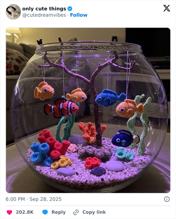 Crocheted fish and coral decorations inside a clear fishbowl, showcasing cute crafts